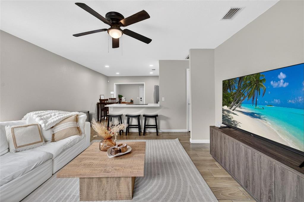 5502 Peach Avenue Seffner, FL 33584 - Photo 14 of 48 a living room with furniture and a flat screen tv