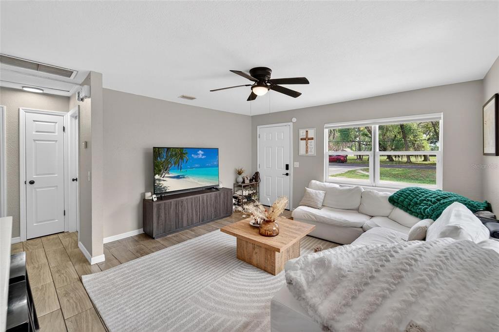 5502 Peach Avenue Seffner, FL 33584 - Photo 16 of 48 a living room with furniture and a flat screen tv