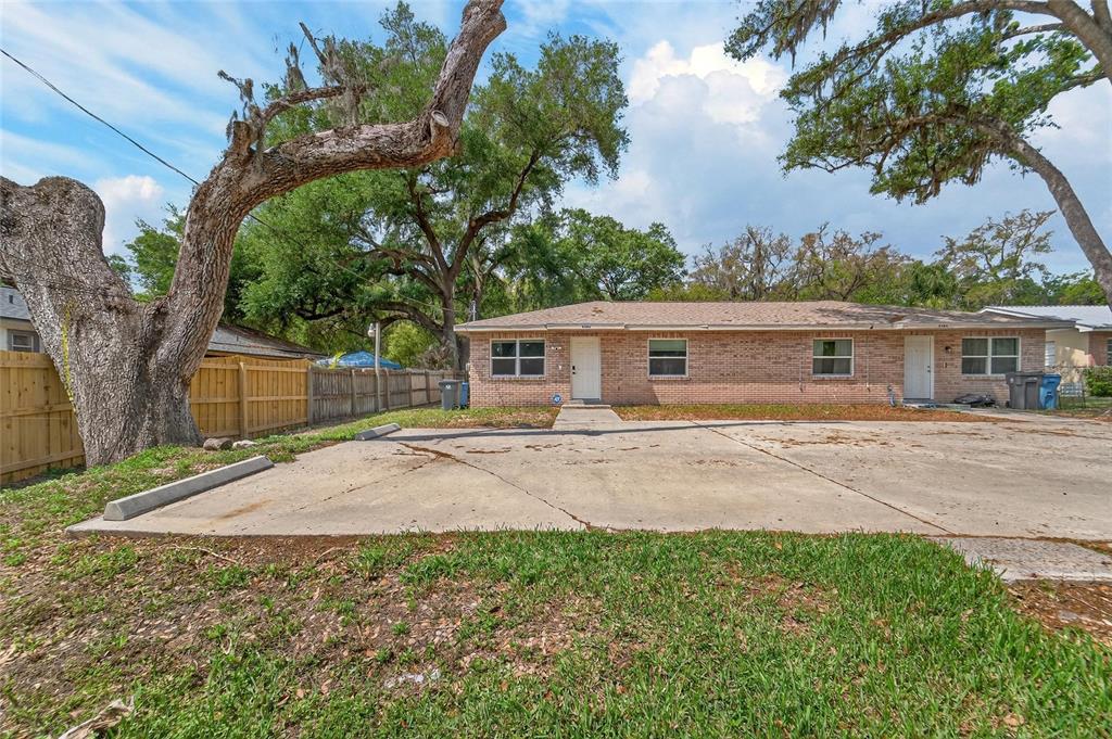 5502 Peach Avenue Seffner, FL 33584 - Photo 2 of 48 front view of house with a yard