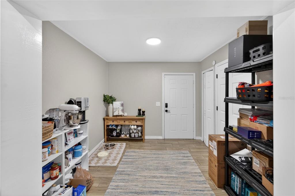 5502 Peach Avenue Seffner, FL 33584 - Photo 24 of 48 a view of a livingroom with shelves