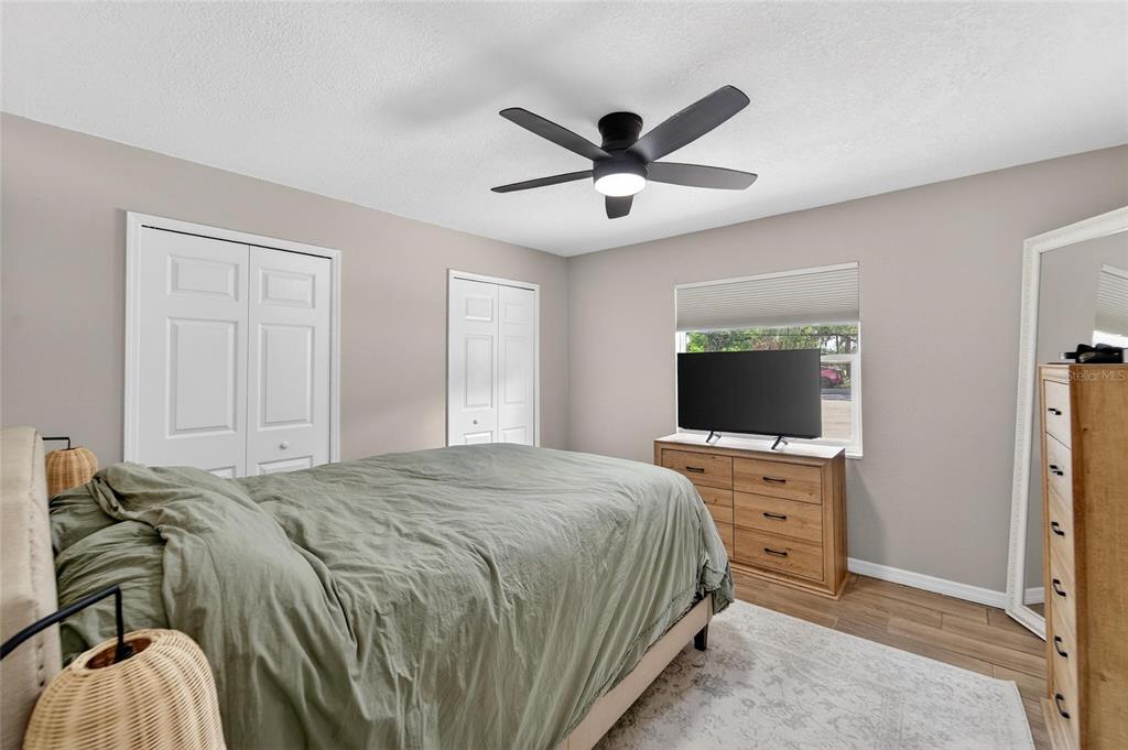5502 Peach Avenue Seffner, FL 33584 - Photo 28 of 48 a bedroom with a bed and a flat screen tv