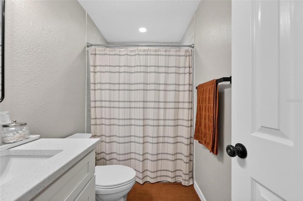 5502 Peach Avenue Seffner, FL 33584 - Photo 33 of 48 a bathroom with a sink toilet and shower