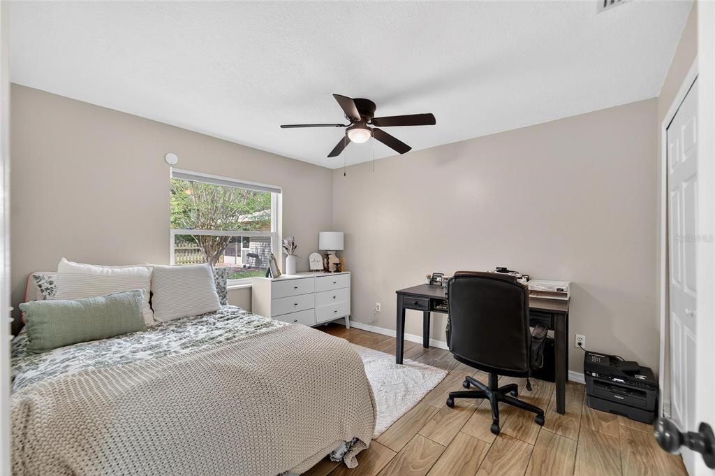 5502 Peach Avenue Seffner, FL 33584 - Photo 34 of 48 a bedroom with a bed and a desk