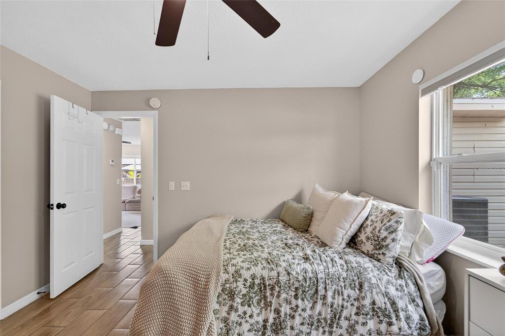 5502 Peach Avenue Seffner, FL 33584 - Photo 37 of 48 a bedroom with a large bed and a large window