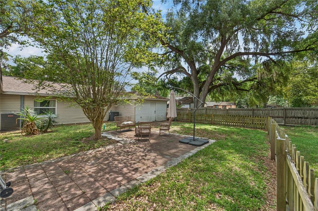 5502 Peach Avenue Seffner, FL 33584 - Photo 44 of 48 a backyard of a house with lots of green space