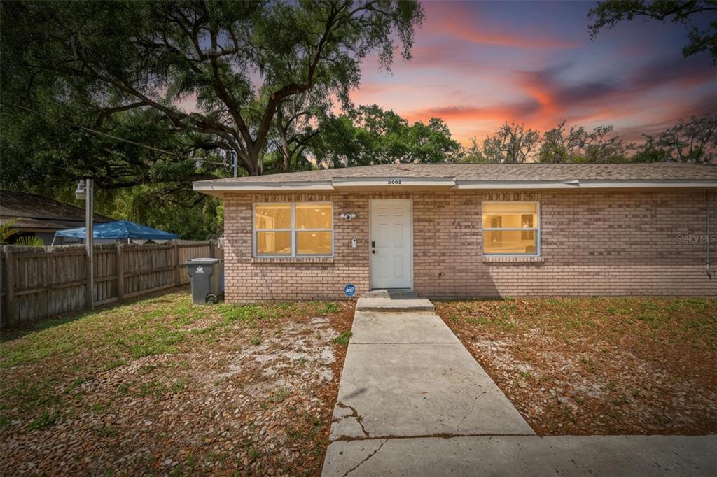 5502 Peach Avenue Seffner, FL 33584 - Photo 6 of 48 a front view of a house with a yard