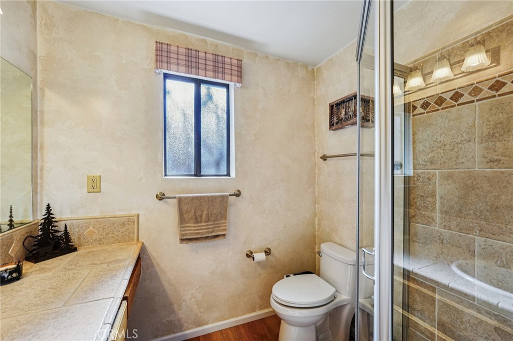 1847 Thrush Road Wrightwood, CA 92397 - Photo 14 of 33 a bathroom with a sink toilet and shower