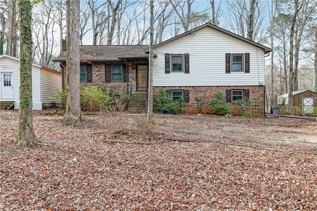 7278 Milam Road Winston, GA 30187 - Photo 1 of 1 a view of a yard in front of a house