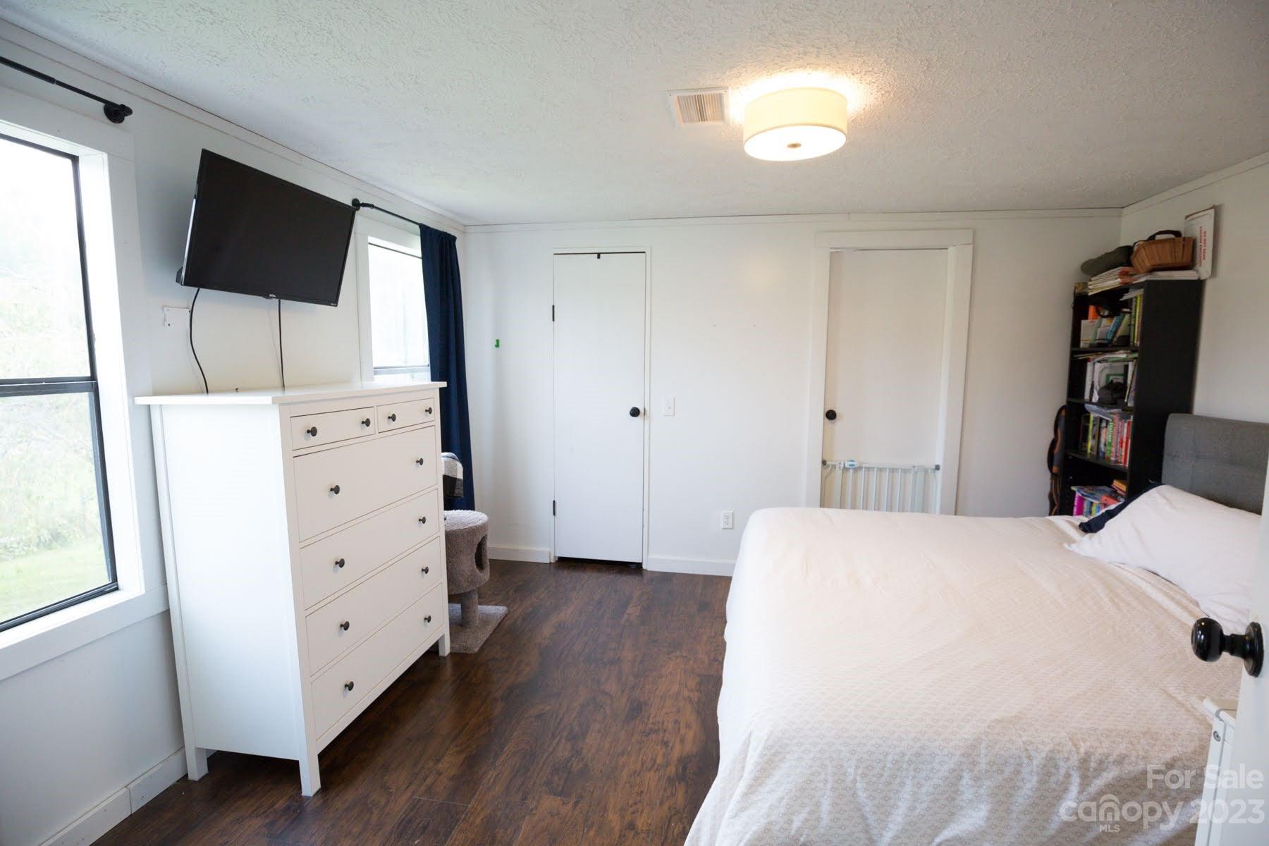 2498 Greenleaf Road, Unit 2 Clover, SC 29710 - Photo 16 of 18 a bedroom with a bed and a flat screen tv