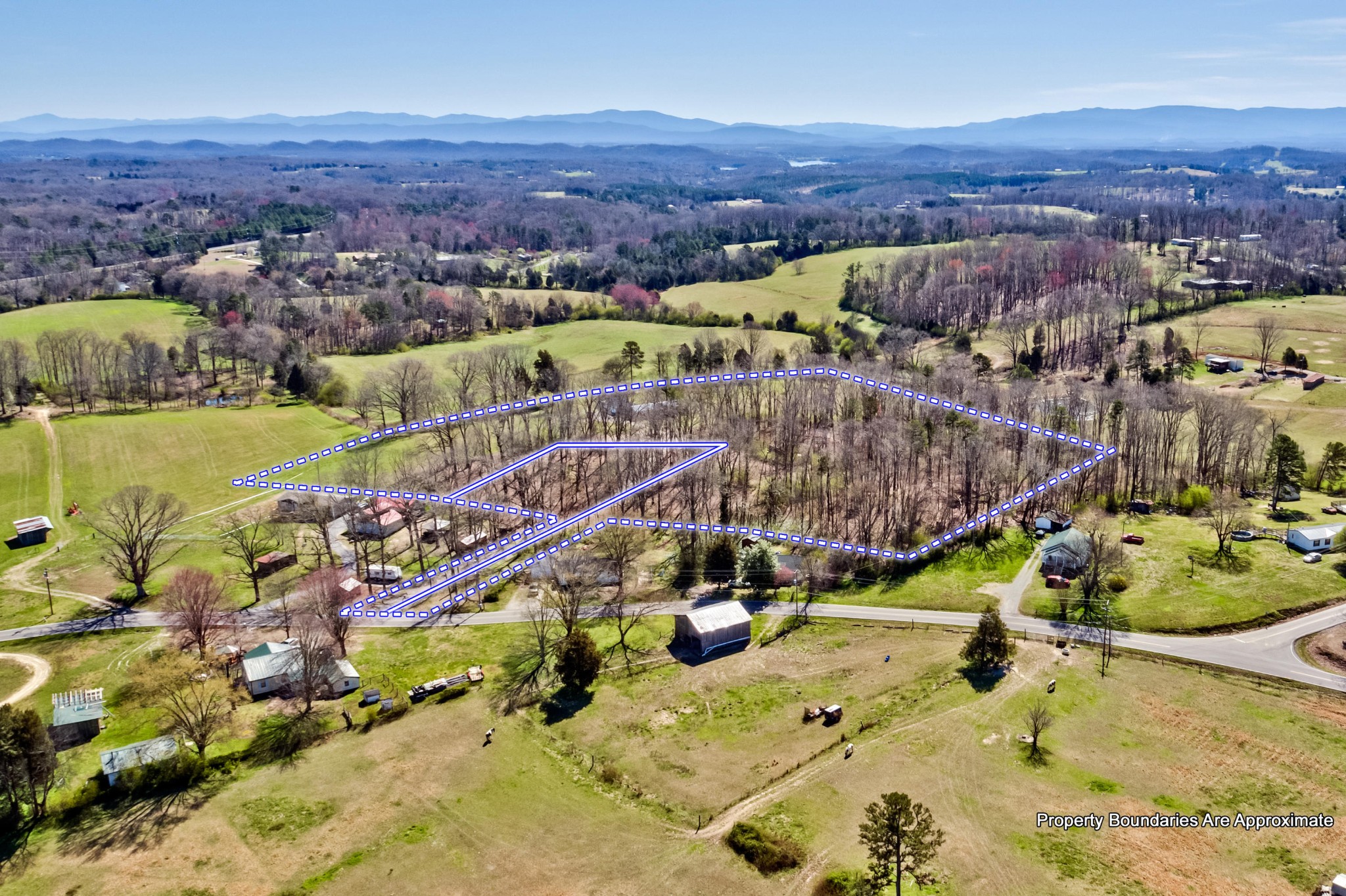 3982 Corinth Road Loudon, TN 37774 - Photo 8 of 11 an aerial view of a house with a garden and lake view