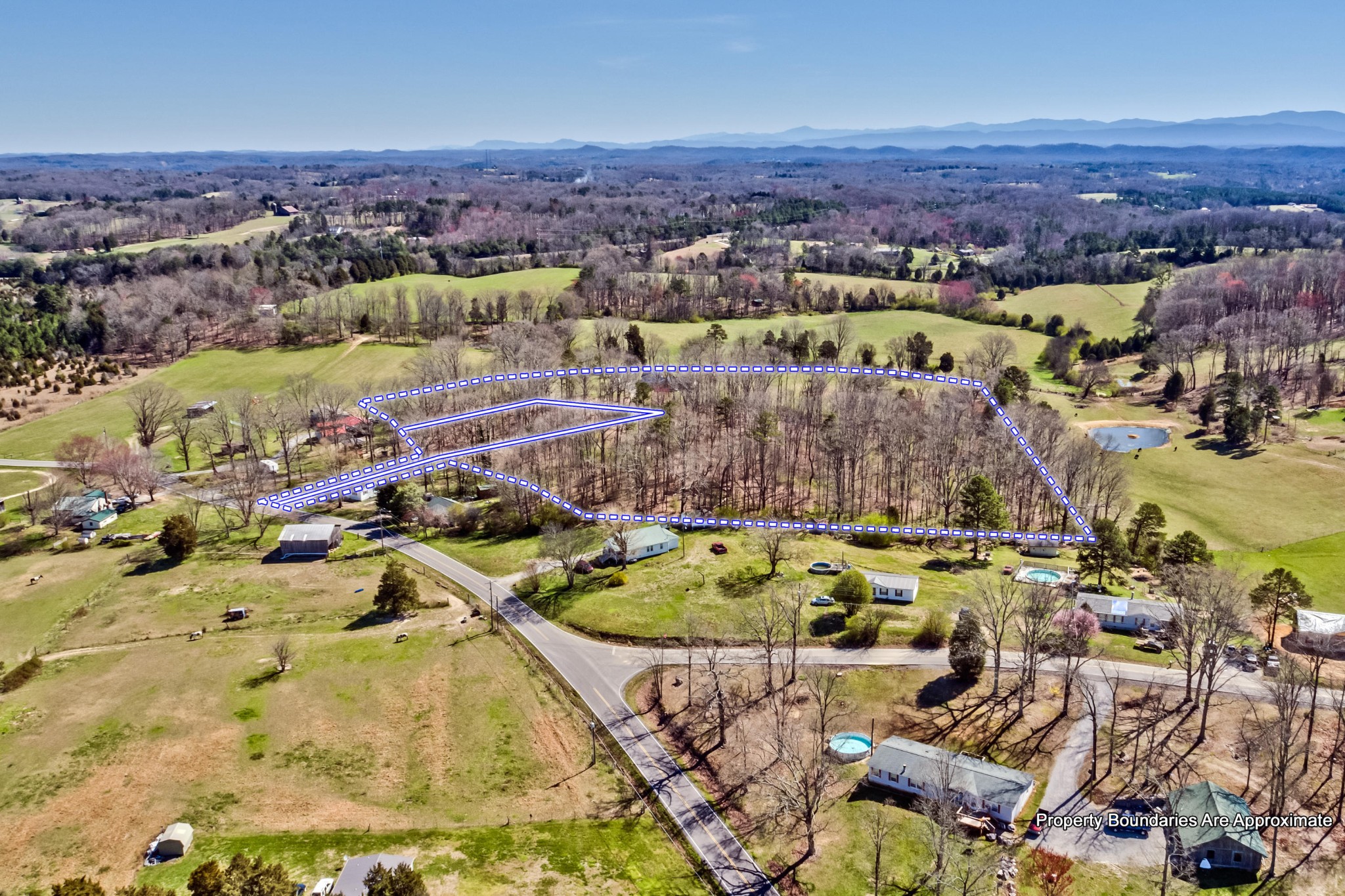 3982 Corinth Road Loudon, TN 37774 - Photo 9 of 11 an aerial view of a house with a swimming pool