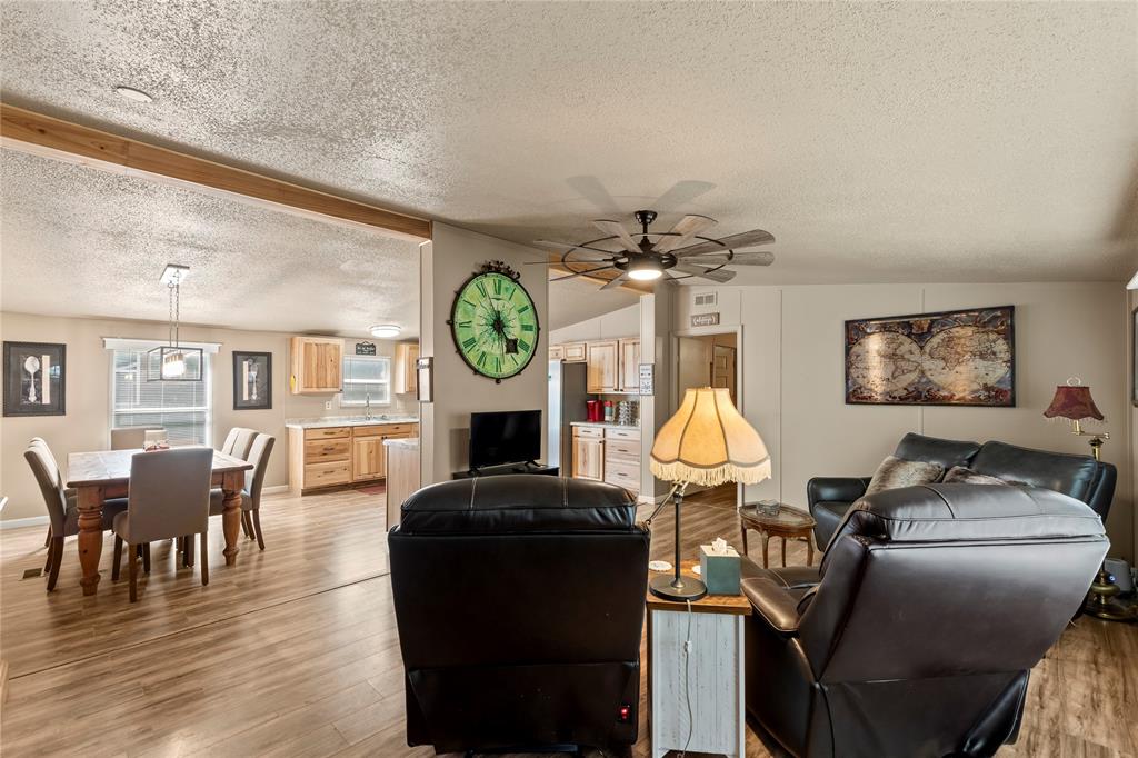 194 Indian Gap Road Mabank, TX 75156 - Photo 3 of 18 a living room with furniture dining table and a clock