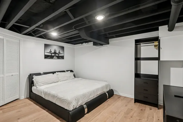 a bedroom with a bed and a closet
