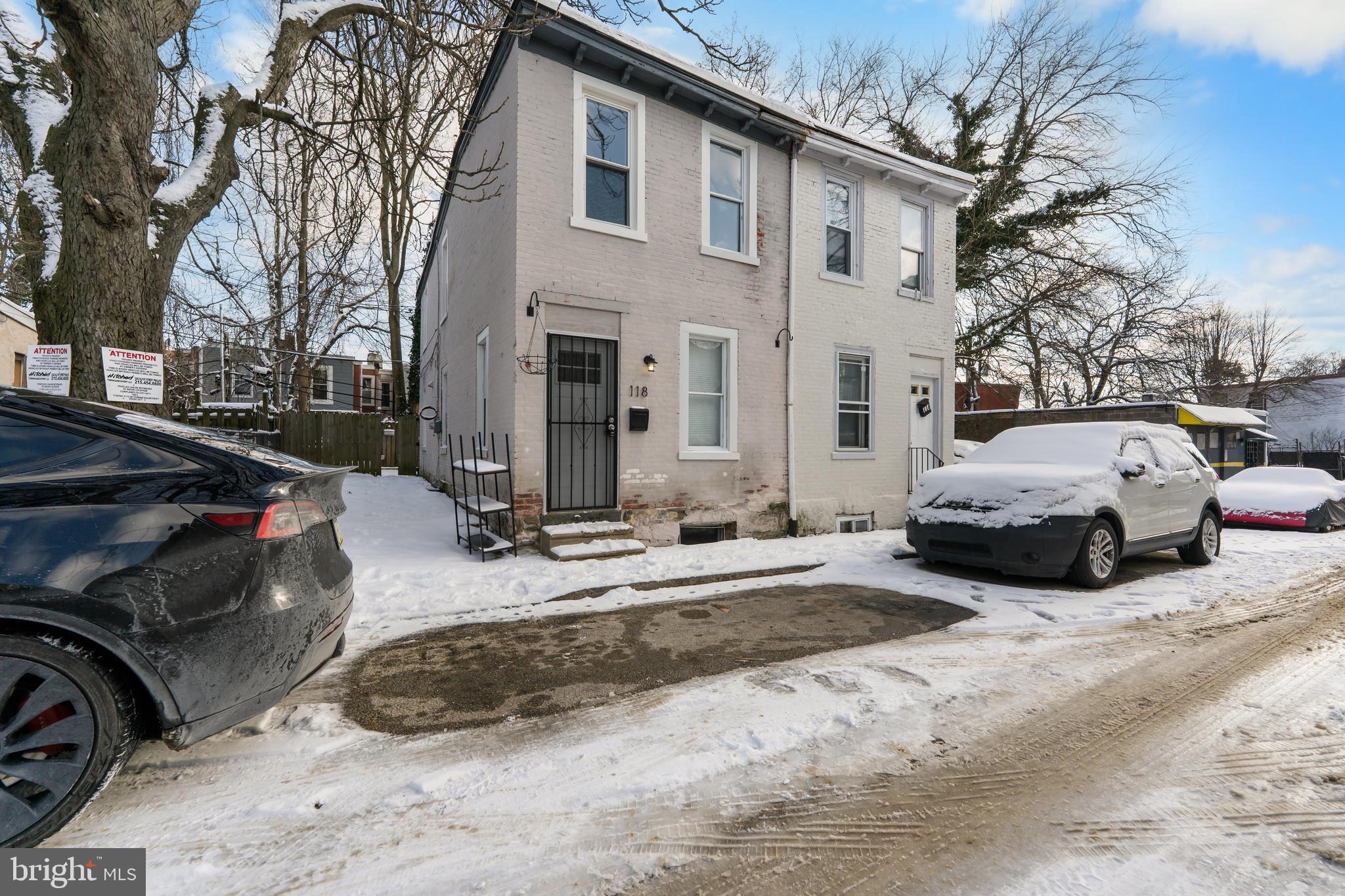 a view of a cars park in front of house
