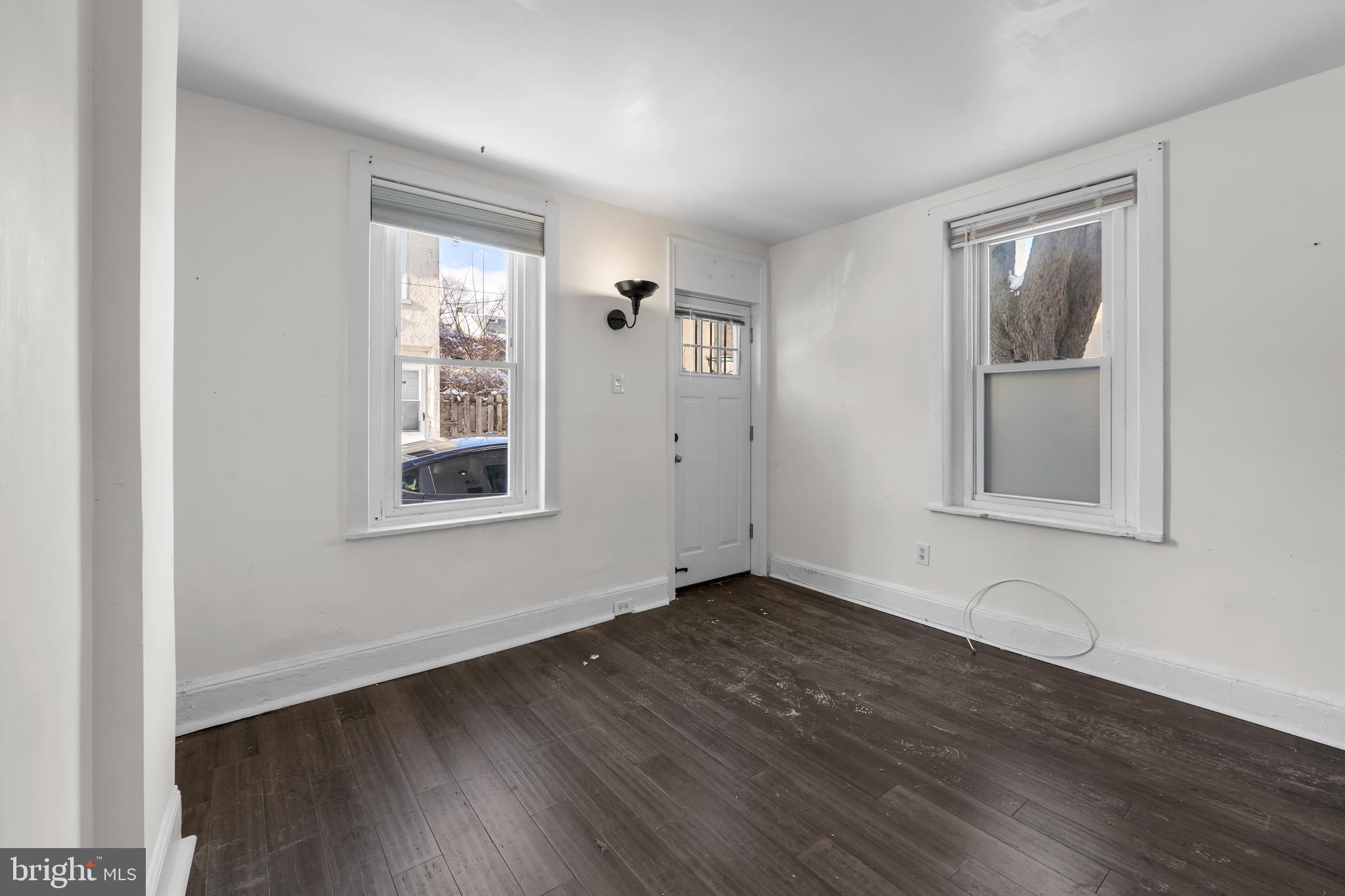 118 East Springer Street Philadelphia, PA 19119 - Photo 11 of 22 a view of an empty room with wooden floor and a window