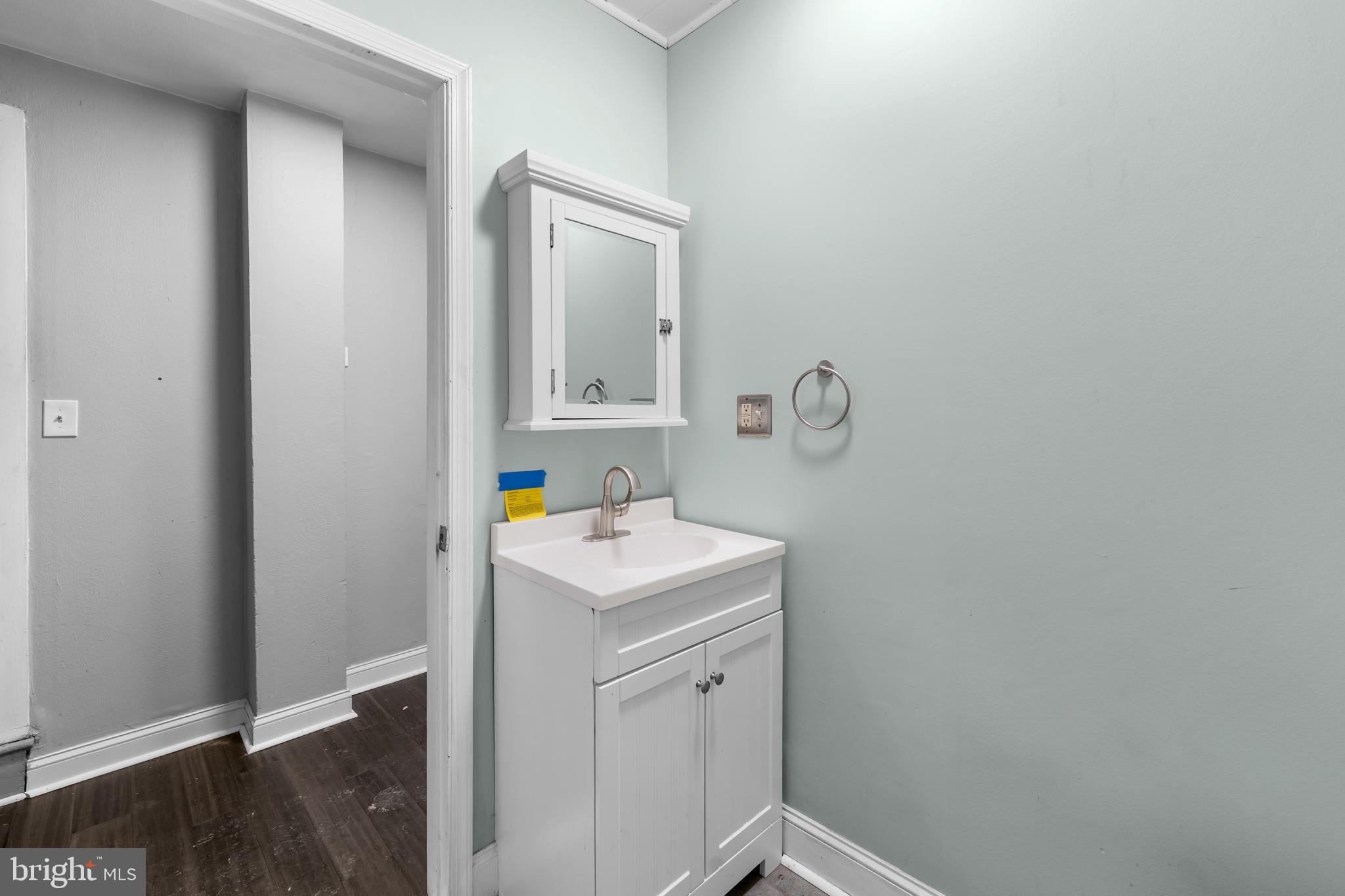 118 East Springer Street Philadelphia, PA 19119 - Photo 13 of 22 a bathroom with a sink a toilet and mirror