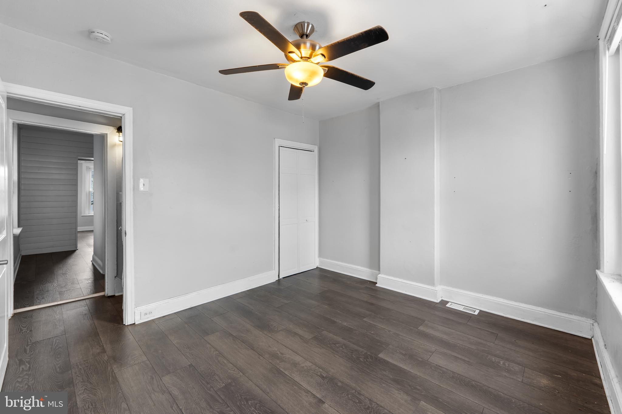 118 East Springer Street Philadelphia, PA 19119 - Photo 15 of 22 an empty room with wooden floor and a ceiling fan