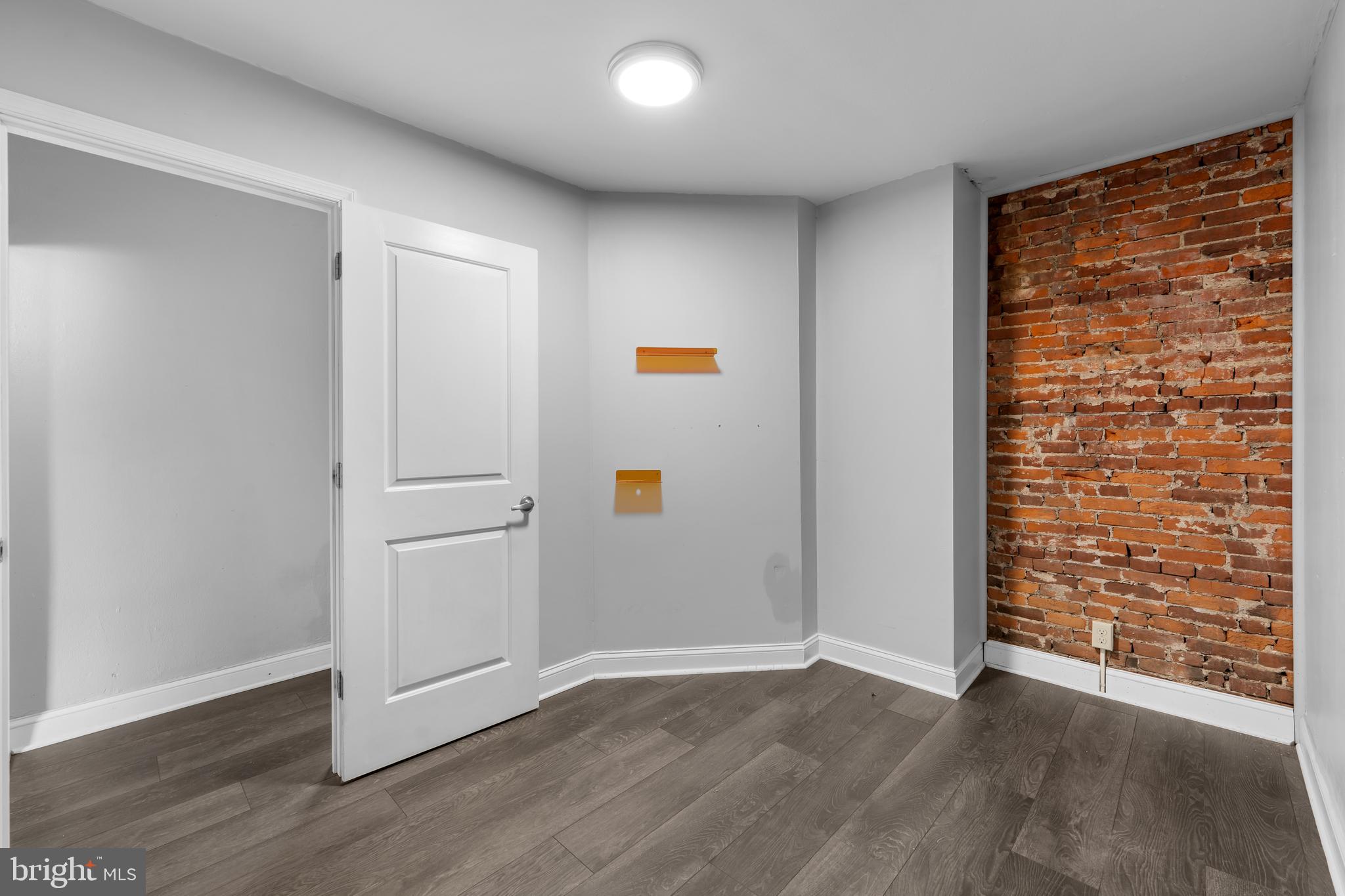 118 East Springer Street Philadelphia, PA 19119 - Photo 16 of 22 an empty room with wooden floor and a window