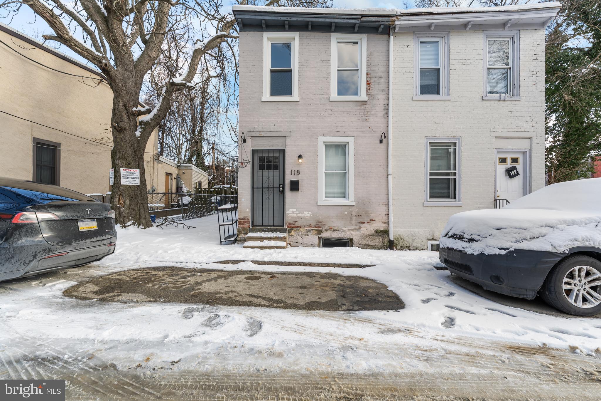 118 East Springer Street Philadelphia, PA 19119 - Photo 21 of 22 a front view of a house with a yard