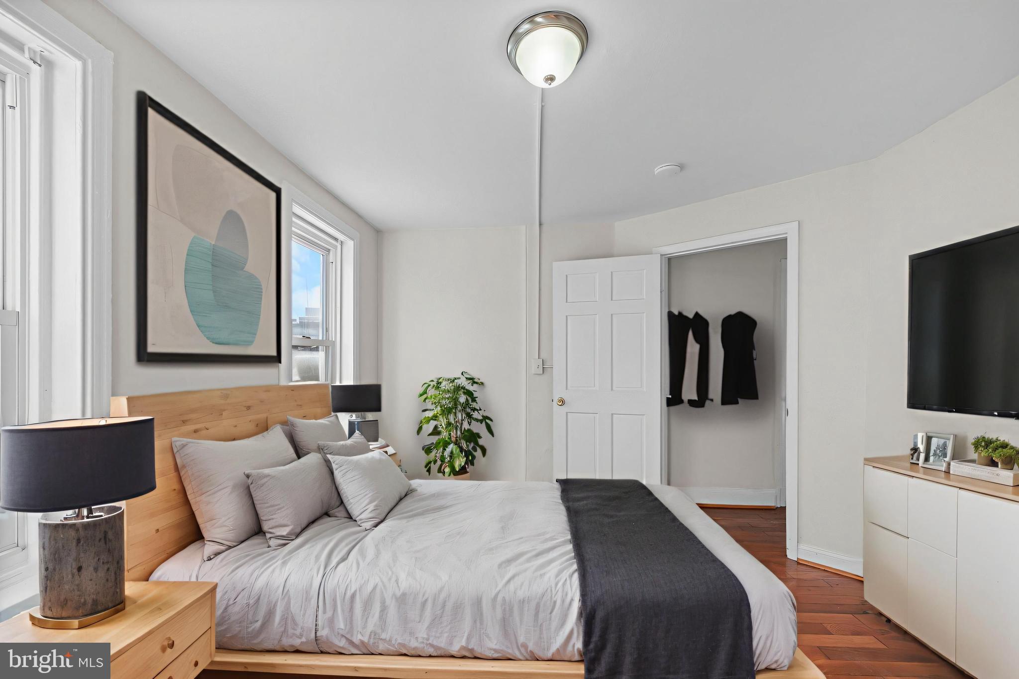 118 East Springer Street Philadelphia, PA 19119 - Photo 5 of 22 a bedroom with a bed and a flat screen tv