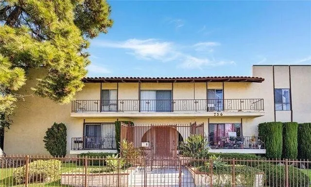 front view of a house with a fountain