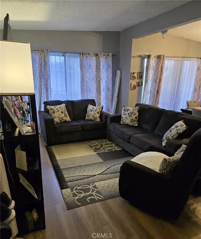 a living room with a couch and a window