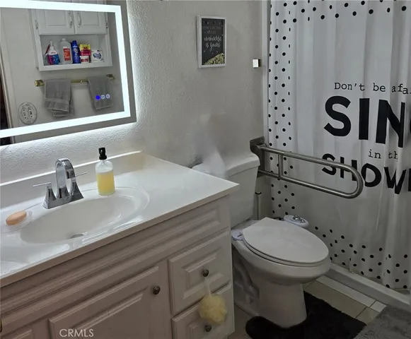 a bathroom with a sink and a toilet