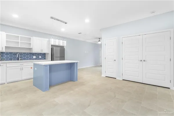 a view of a kitchen with a sink cabinets and window