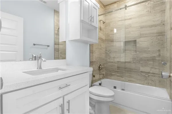 a bathroom with a sink a toilet and a bathtub