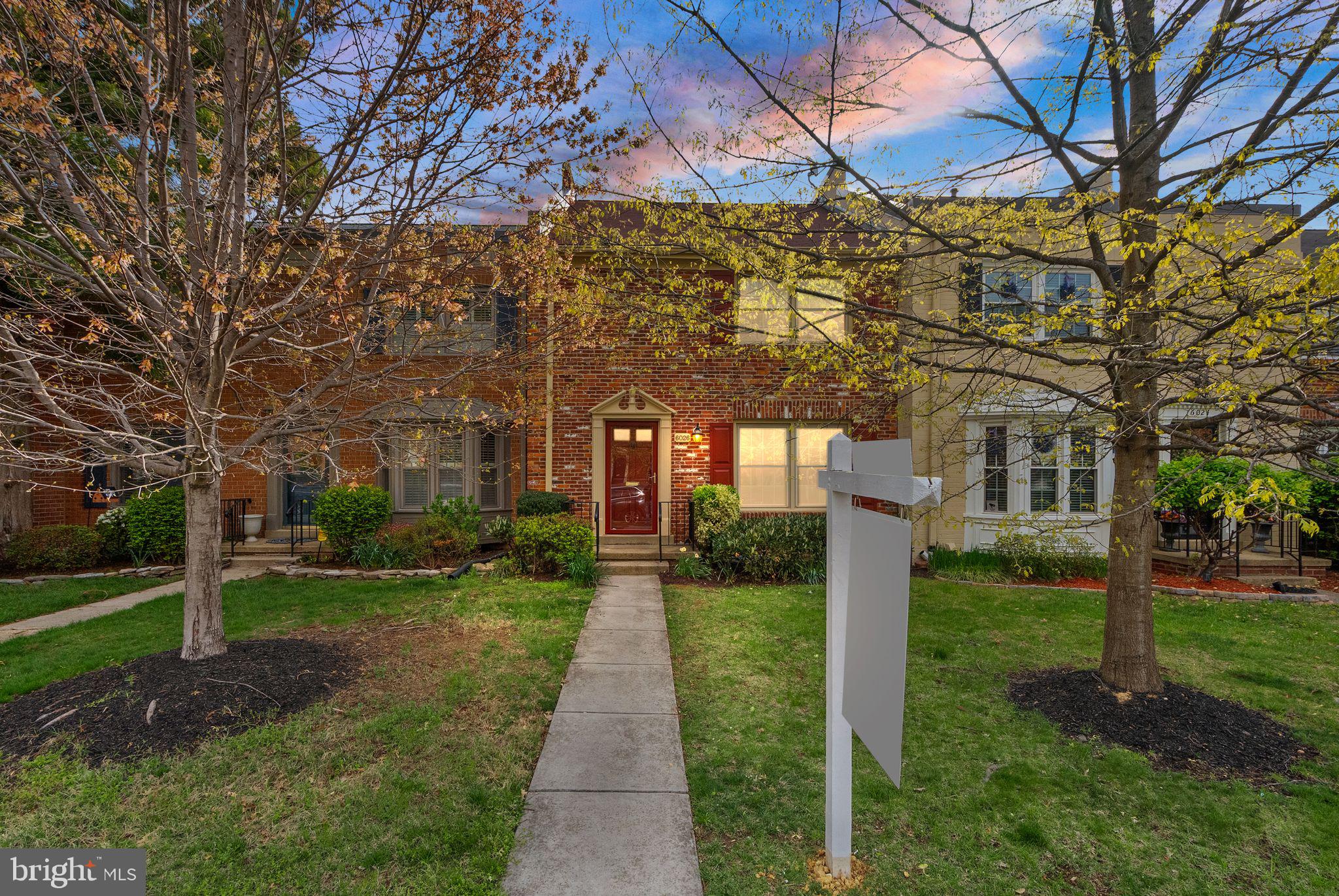 6026 Queenston Street Springfield, VA 22152 - Photo 2 of 53 a front view of a house with a yard