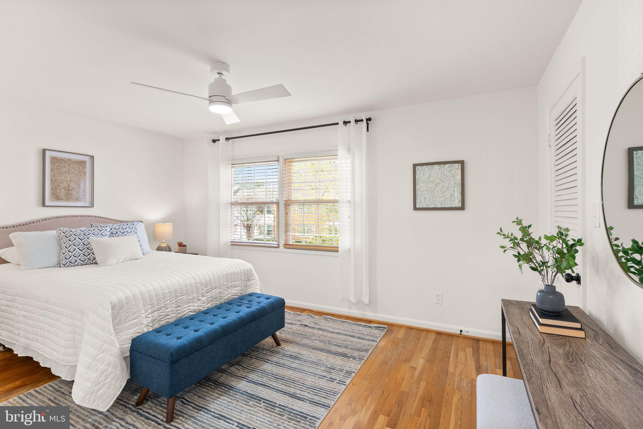 6026 Queenston Street Springfield, VA 22152 - Photo 21 of 53 a bedroom with a bed and wooden floor
