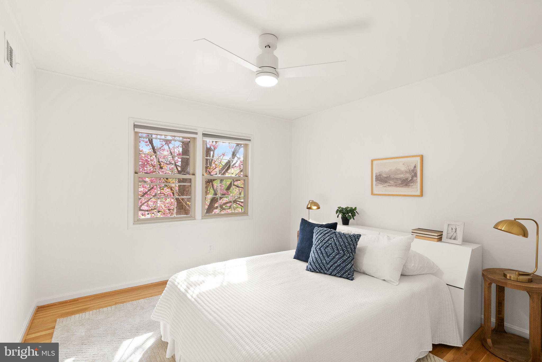 6026 Queenston Street Springfield, VA 22152 - Photo 27 of 53 a bedroom with a large bed and a window