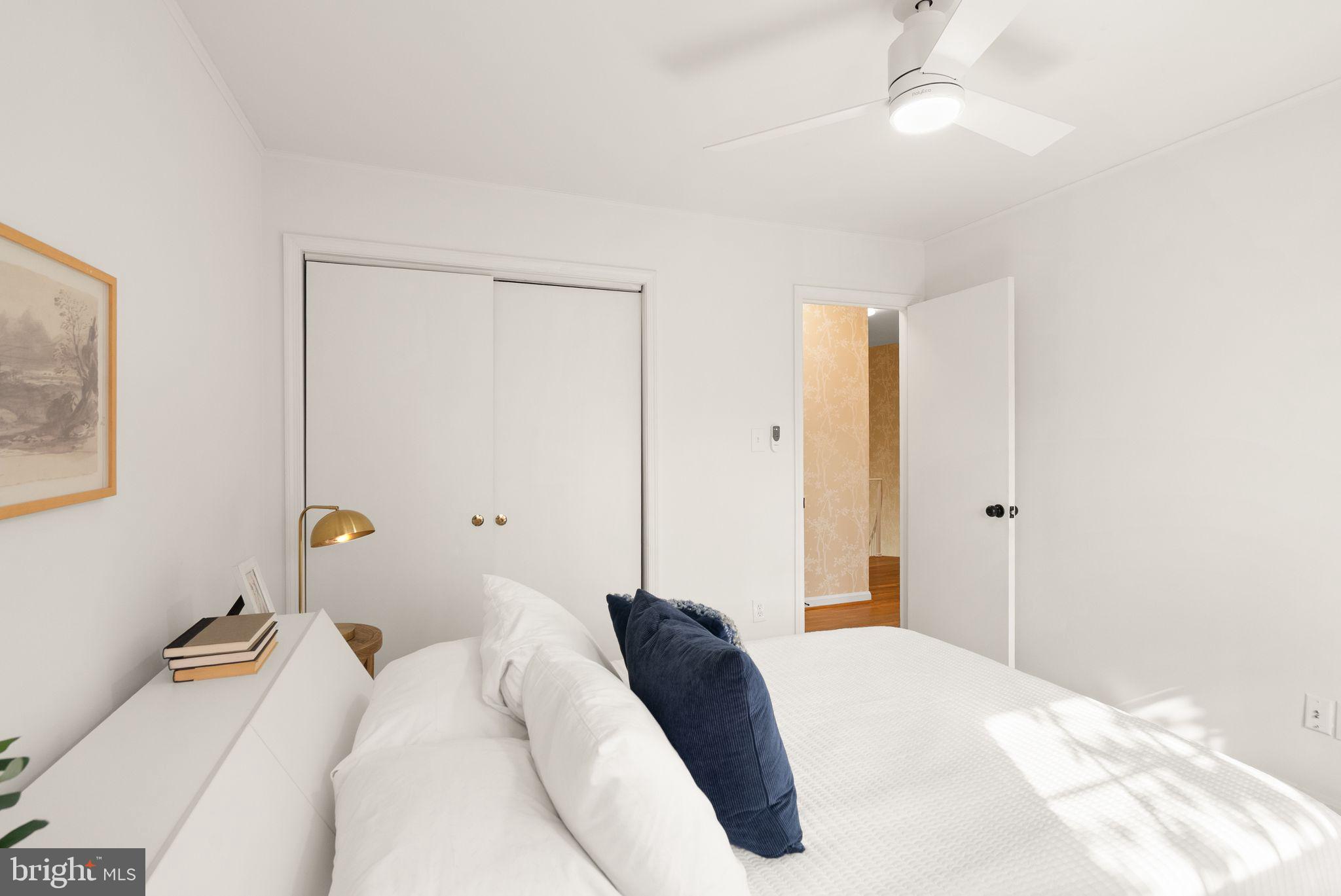 6026 Queenston Street Springfield, VA 22152 - Photo 29 of 53 a bedroom with a bed and a chandelier