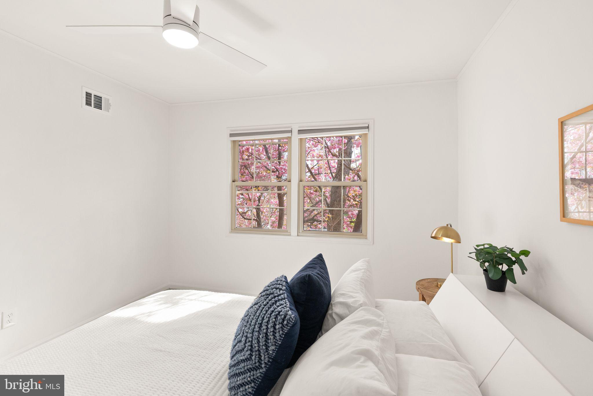 6026 Queenston Street Springfield, VA 22152 - Photo 30 of 53 a bedroom with a bed and a painting on the wall