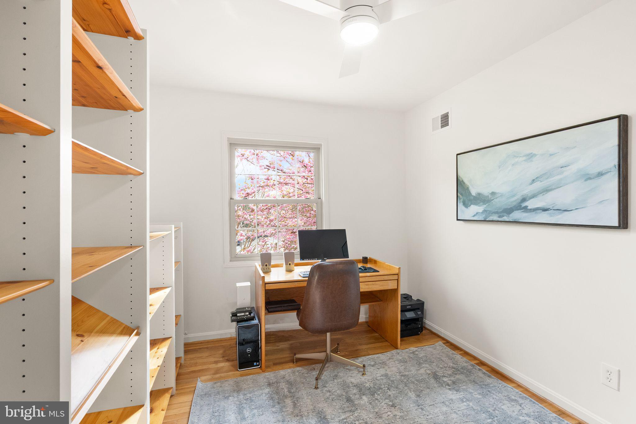 6026 Queenston Street Springfield, VA 22152 - Photo 32 of 53 a view of a workspace with furniture and a window