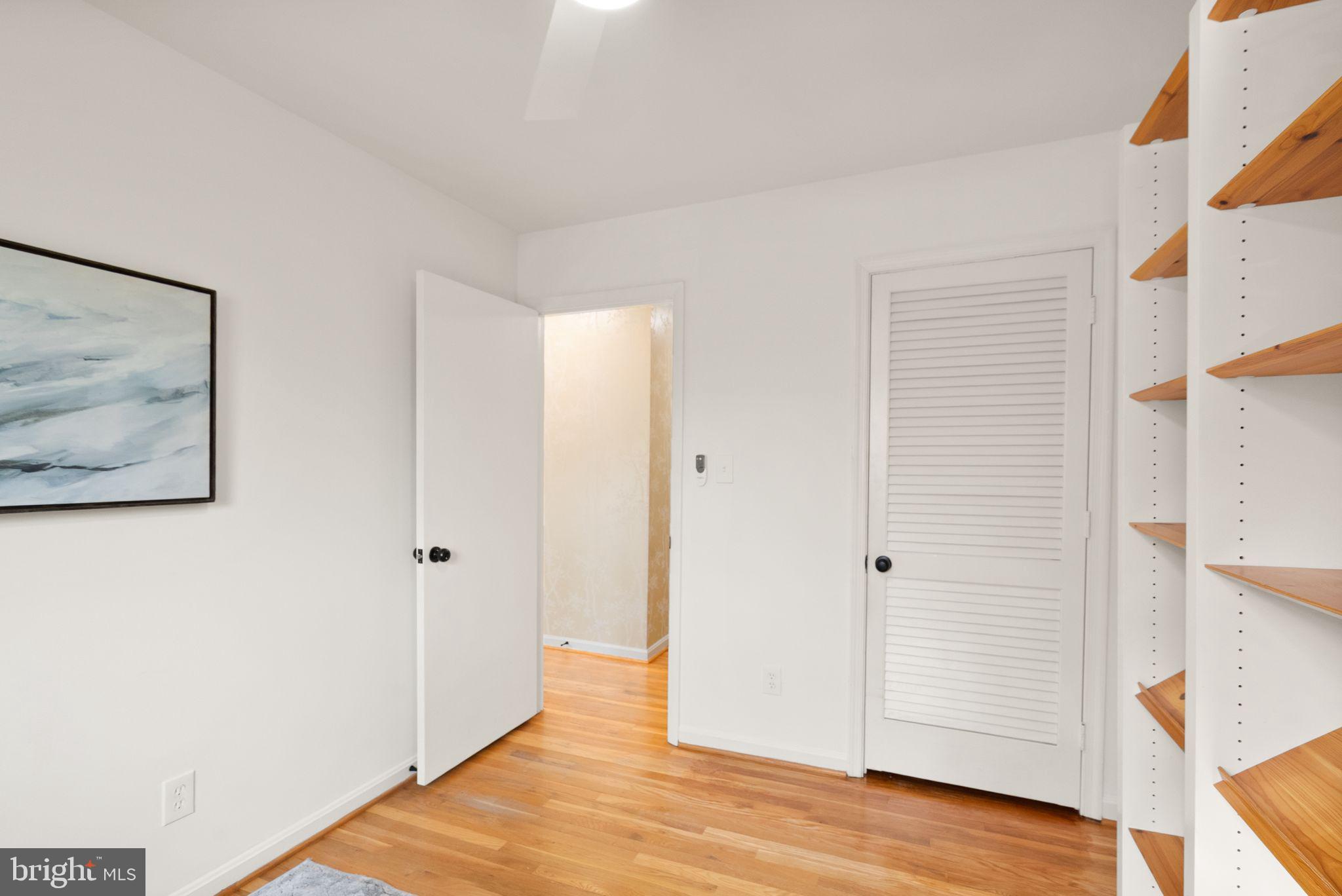 6026 Queenston Street Springfield, VA 22152 - Photo 34 of 53 a view of a hallway with wooden floor