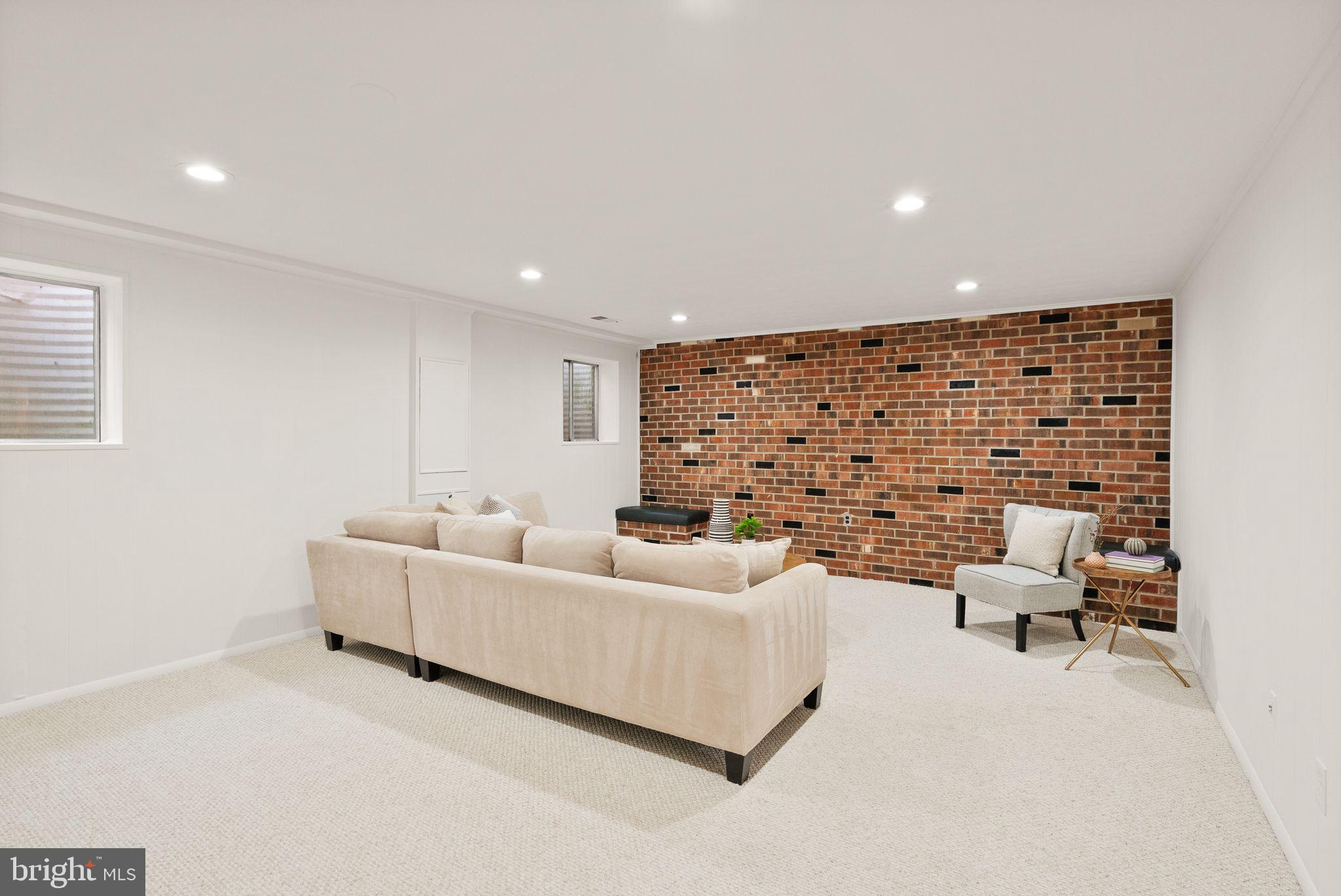 6026 Queenston Street Springfield, VA 22152 - Photo 37 of 53 a living room with furniture and a fireplace