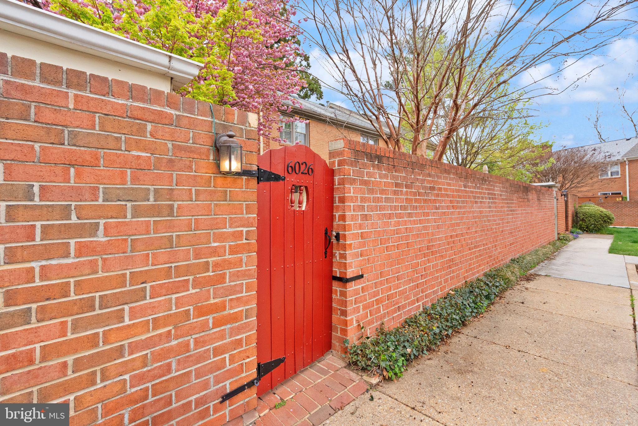 6026 Queenston Street Springfield, VA 22152 - Photo 49 of 53 a brick building with a street