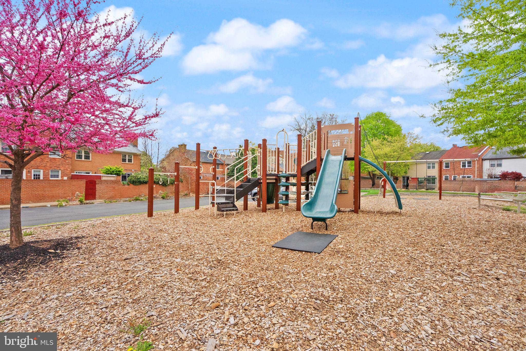6026 Queenston Street Springfield, VA 22152 - Photo 51 of 53 a view of a park with swings and slides