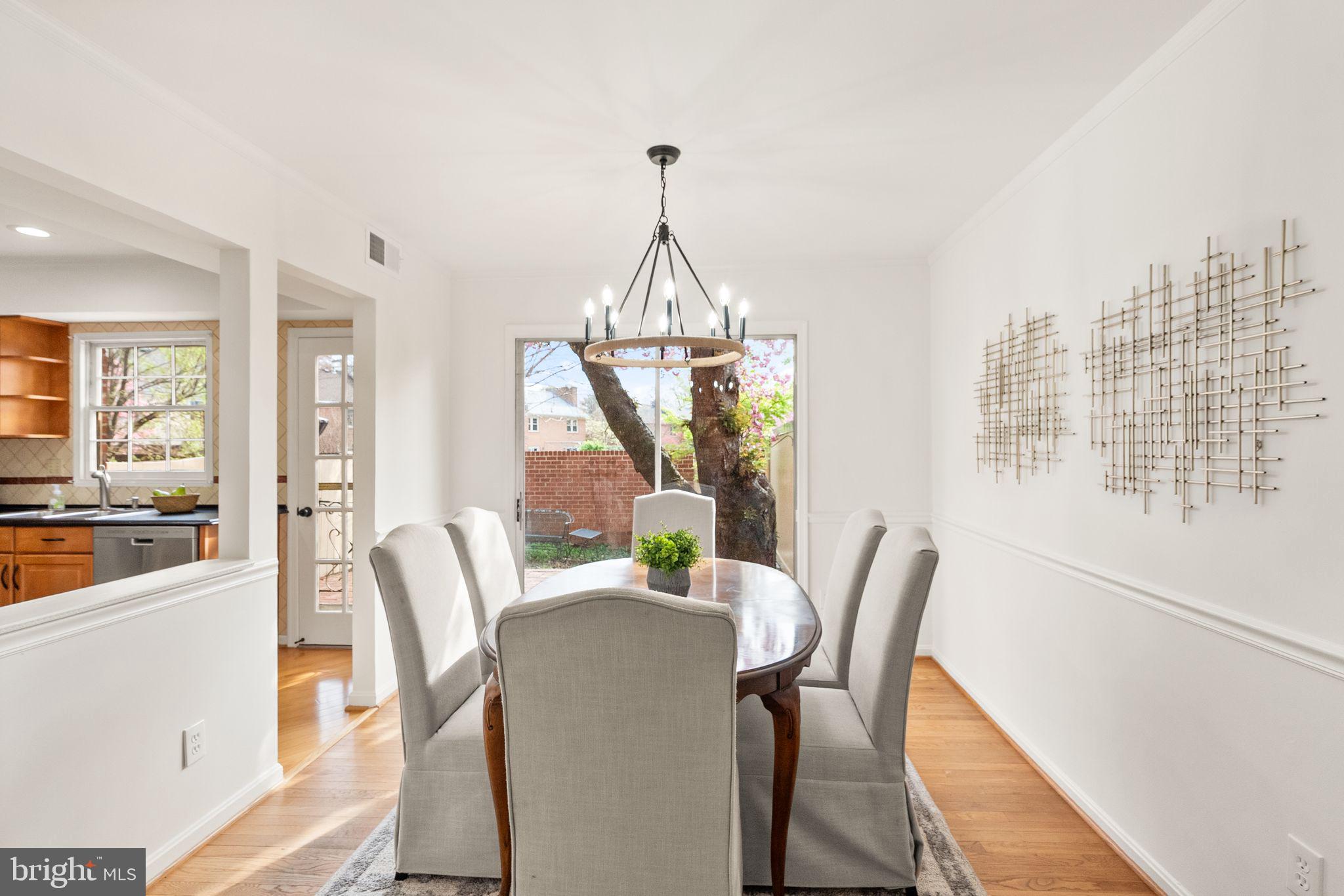 6026 Queenston Street Springfield, VA 22152 - Photo 9 of 53 a view of a dining room with furniture window and wooden floor