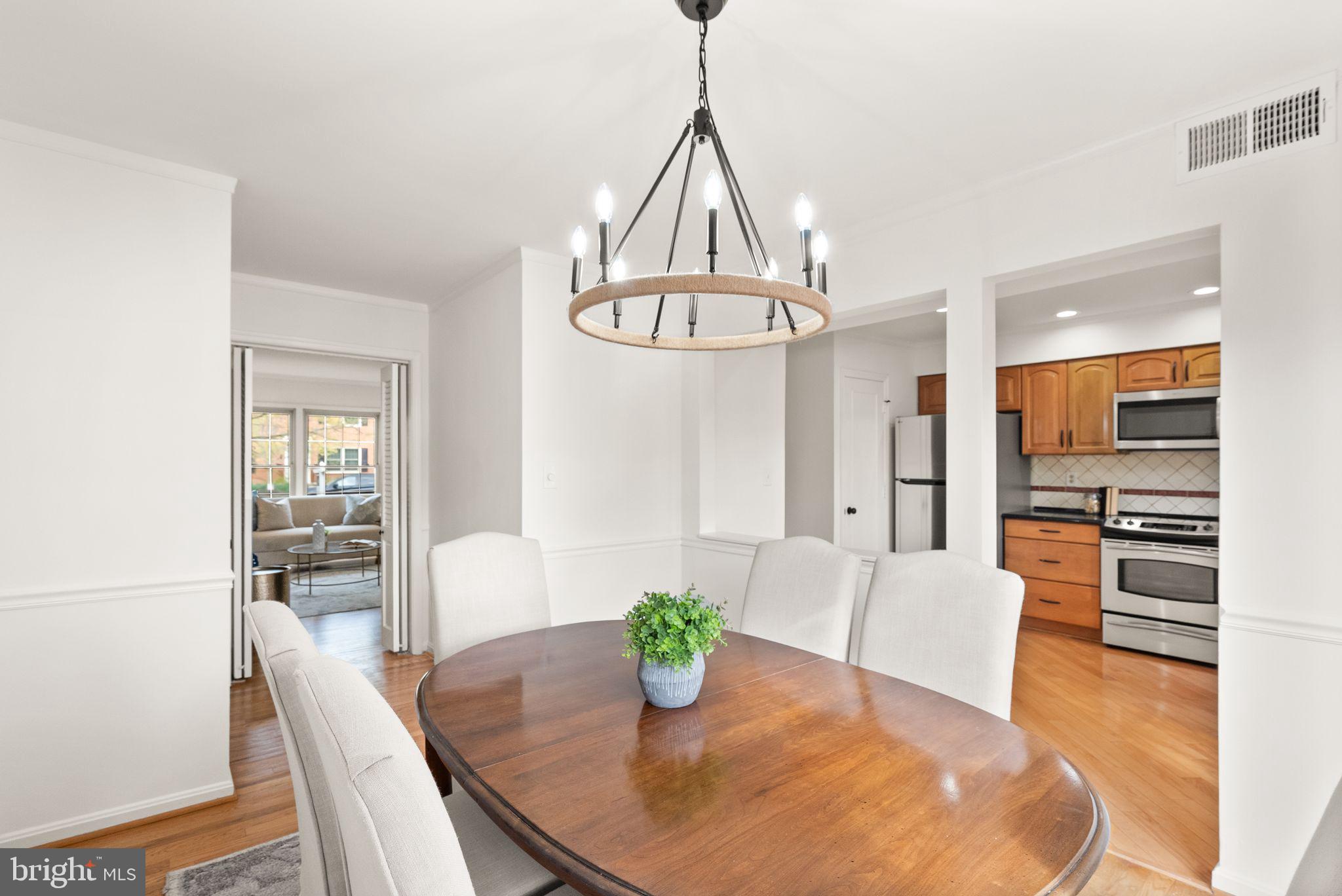 6026 Queenston Street Springfield, VA 22152 - Photo 10 of 53 a view of a dining room with furniture