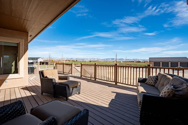 a view of a balcony with wooden floor