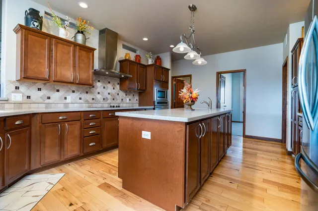 a bathroom with a sink a vanity and a large mirror
