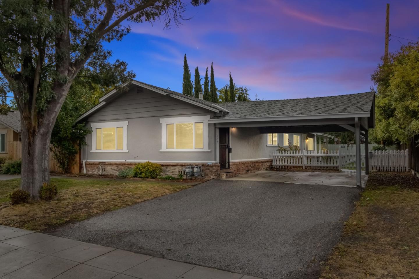 a view of a house with a yard and garage