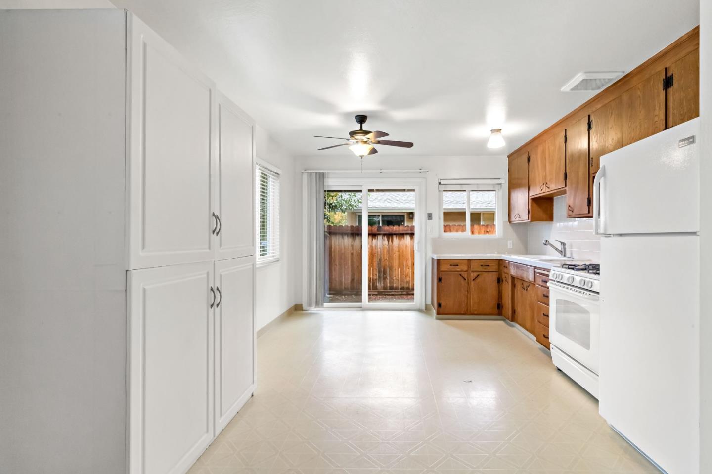 527 Easy Street Mountain View, CA 94043 - Photo 33 of 57 a large white kitchen with stainless steel appliances