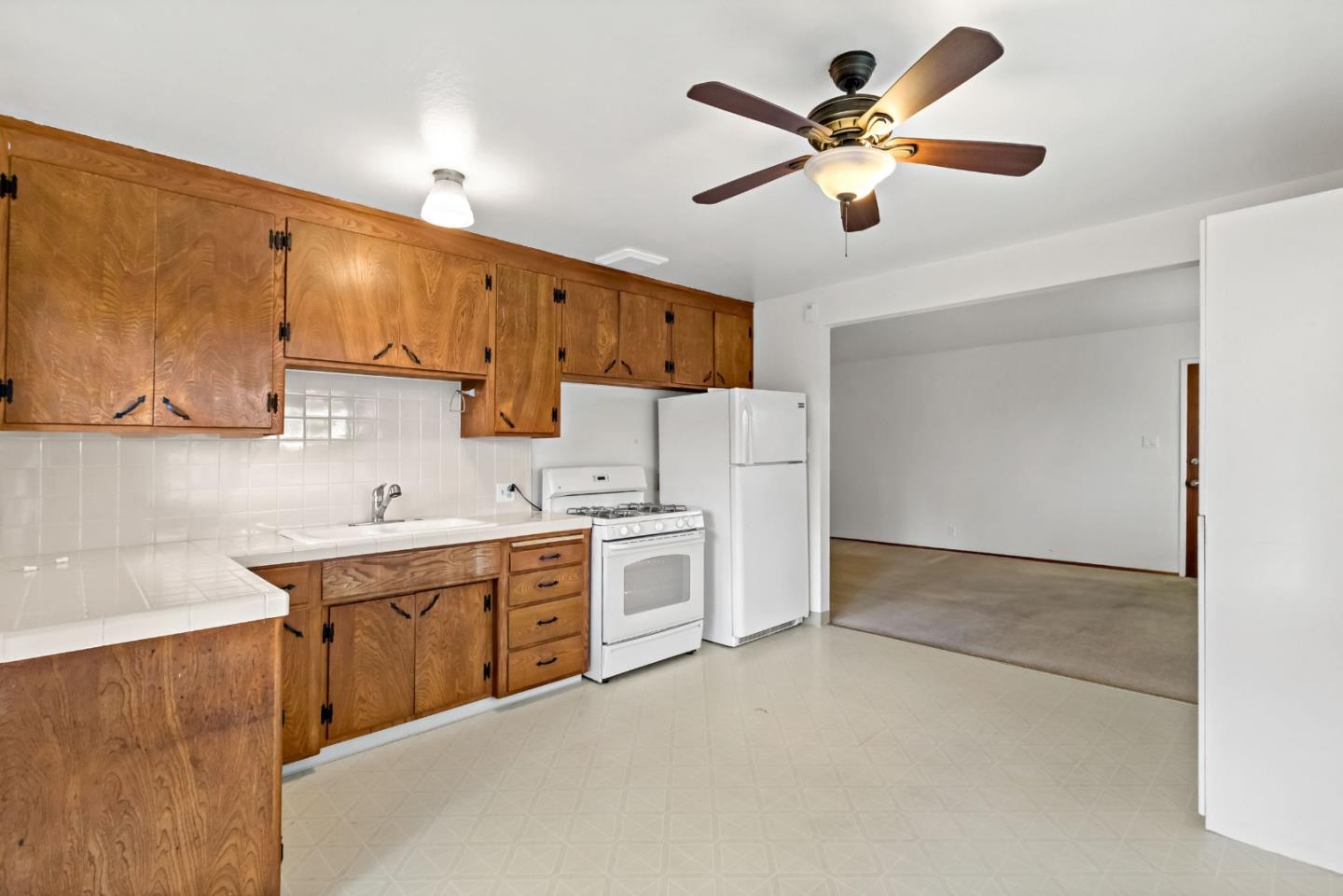 527 Easy Street Mountain View, CA 94043 - Photo 39 of 57 a kitchen with cabinets stove and a sink