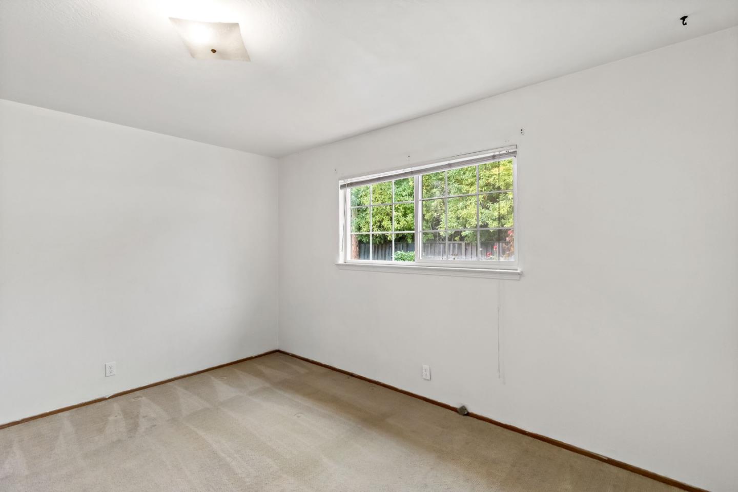 527 Easy Street Mountain View, CA 94043 - Photo 41 of 57 an empty room with a window