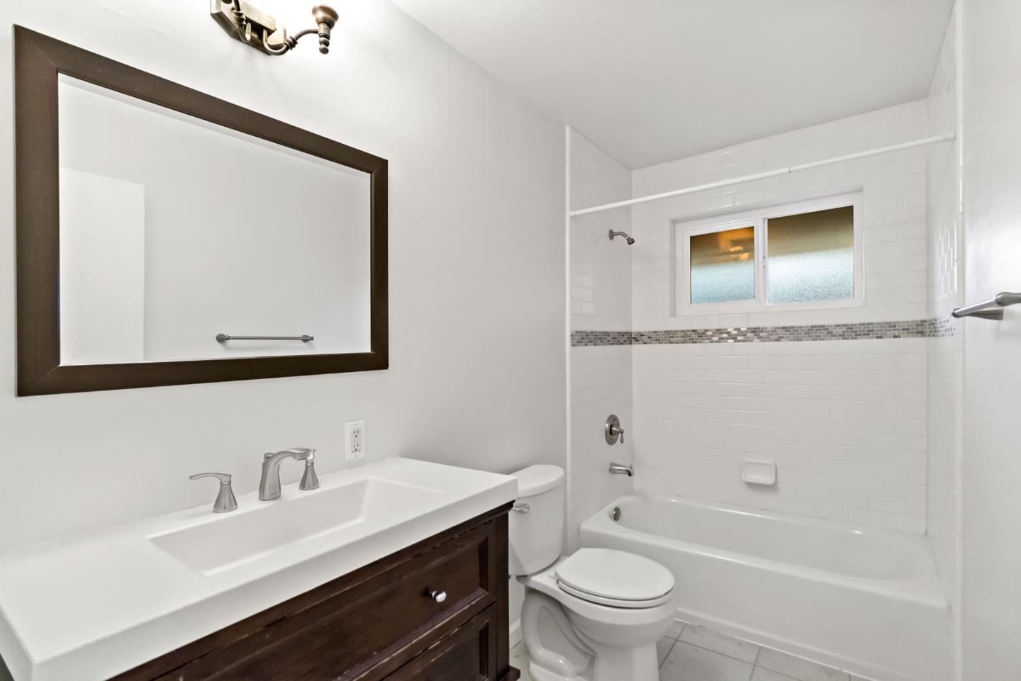 527 Easy Street Mountain View, CA 94043 - Photo 44 of 57 a bathroom with a toilet a sink a mirror a bathtub and vanity