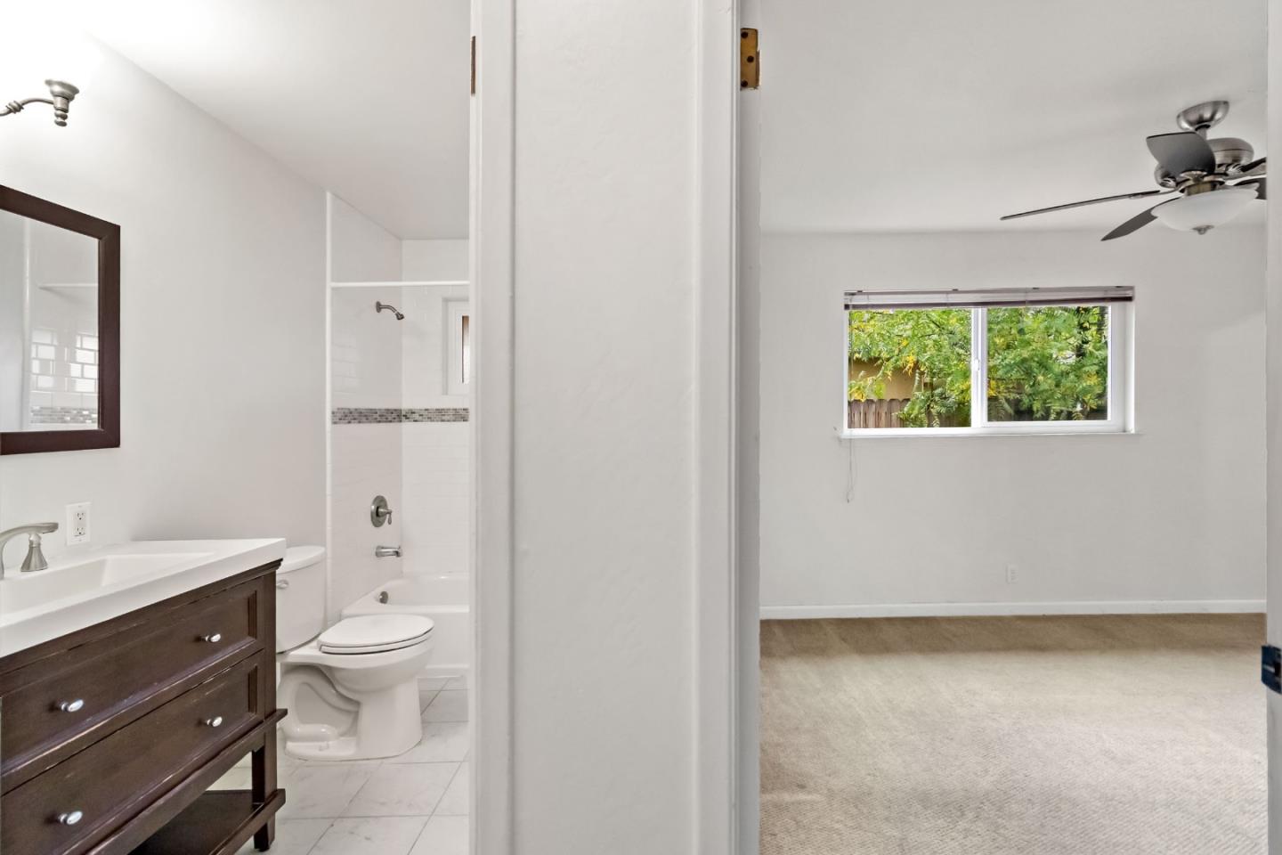 527 Easy Street Mountain View, CA 94043 - Photo 45 of 57 a bathroom with a toilet a sink and a large mirror