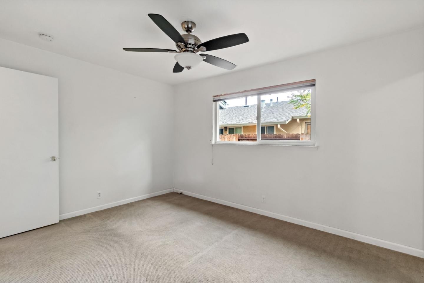 527 Easy Street Mountain View, CA 94043 - Photo 48 of 57 an empty room with windows and fan